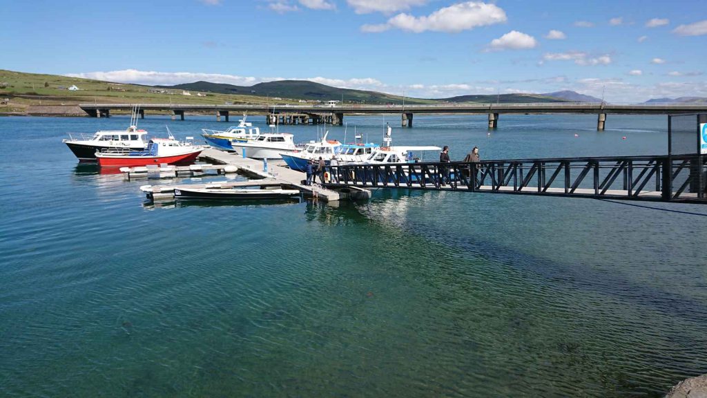 Boats at Portmagee marina, with the Valentia Island bridge behind
