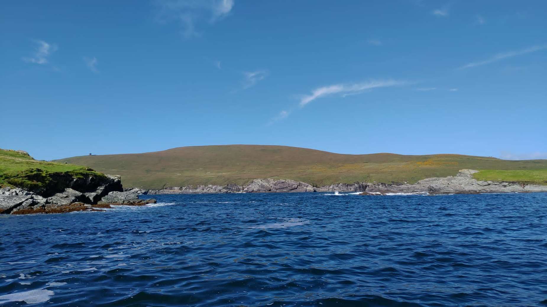 A green headland seen from the sea