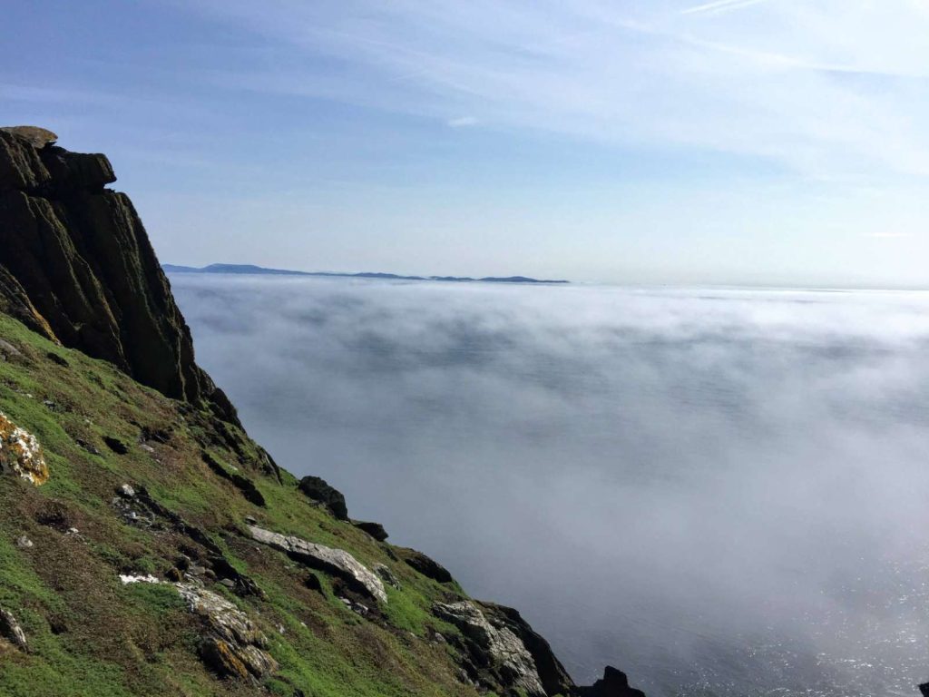Low cloud over the sea below the cliffs of Skellig Michael