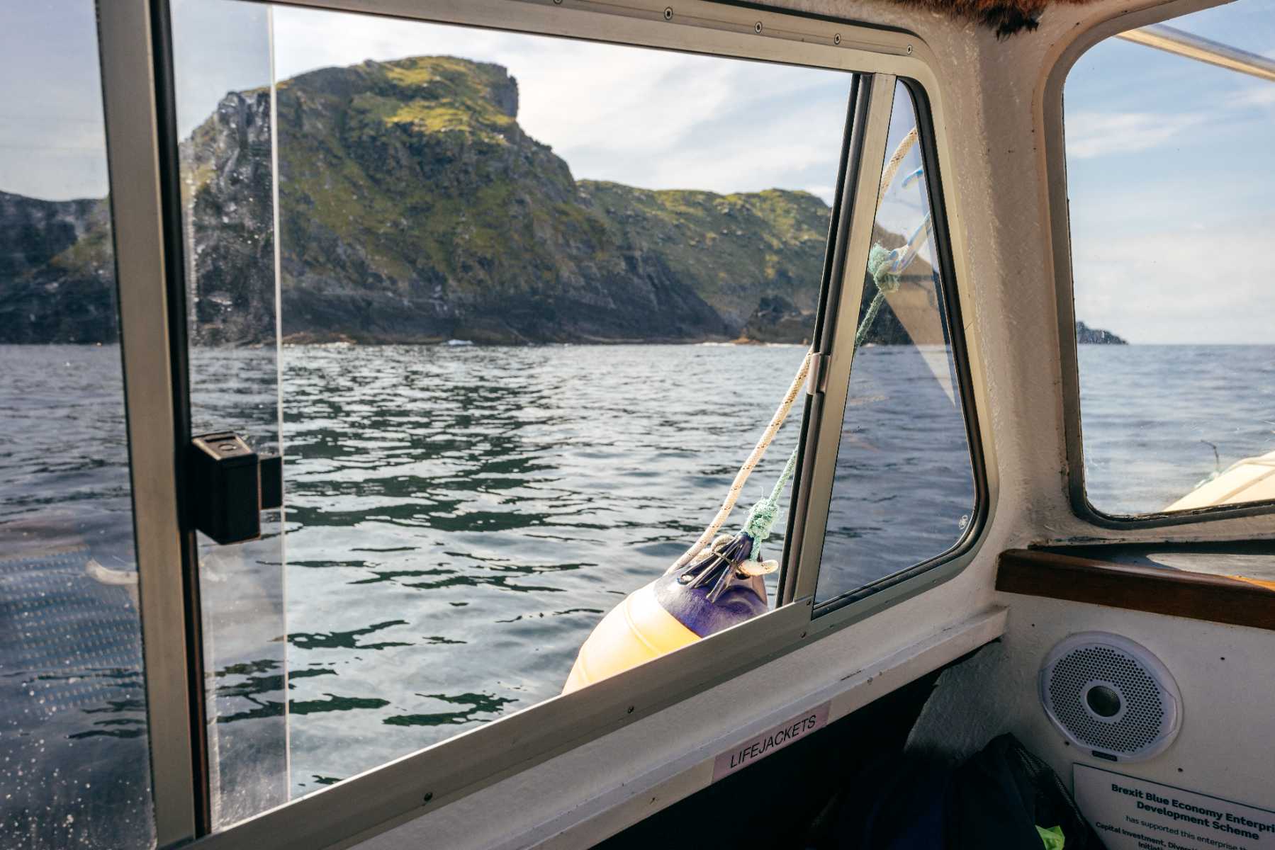 The coast seen through the window of the boat
